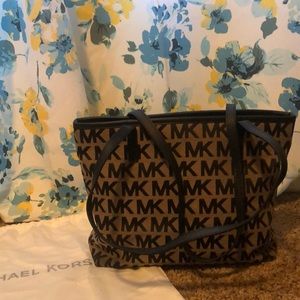 Brown and black Micheal Kors bag